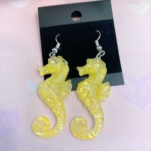 seahorse earrings. Yellow.